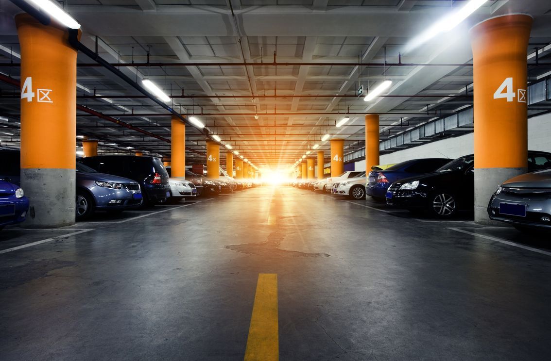 Parking Garage Underground Interior With A Few Parked Cars